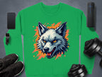 The Garment Graphics sweatshirt features a fierce wolf head among orange splatters on gray, surrounded by a smartphone, wireless speaker, smartwatch, shoes, and weights.