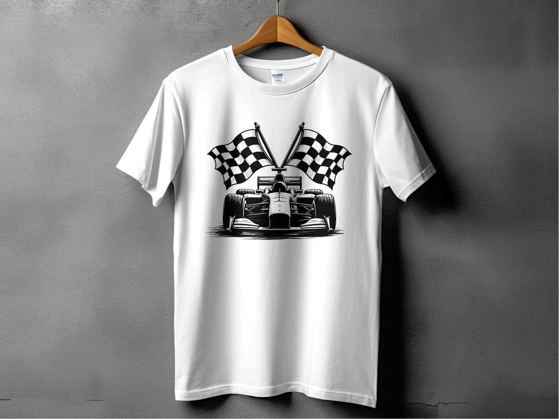Garment Graphics white graphic T-shirt, showcasing a race car with crossed checkered flags, captures the thrill of Formula One racing. Its displayed on a wooden hanger against a gray wall.