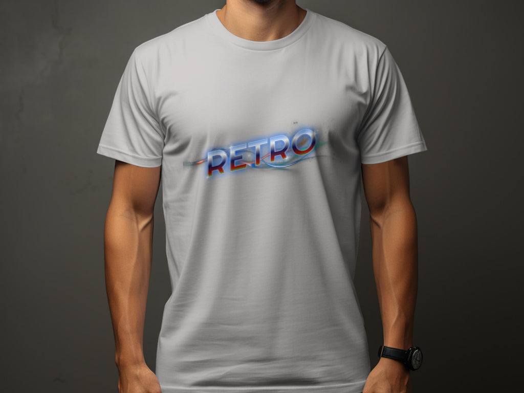 A person wears a Garment Graphics light gray t-shirt with RETRO in a bold, distorted font across the chest, exuding vintage charm. The background is muted dark gray; their visible arms include a wristwatch on the right wrist.