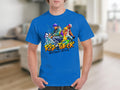 Clad in a Garment Graphics blue t-shirt showcasing two dancers in vibrant attire, someone celebrates street dance culture. The shirt boasts the text Risk Taker Street Dance 10th Final against a blurred indoor background.