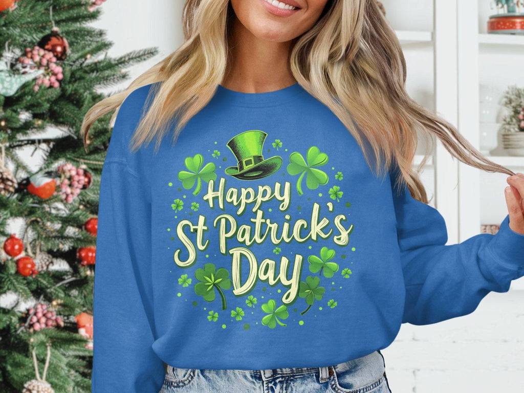 Wearing Garment Graphics blue shamrock graphic sweatshirt with Happy St. Patricks Day, someone stands indoors, radiating festive cheer near a decorated Christmas tree against a backdrop of shamrocks and a green top hat.