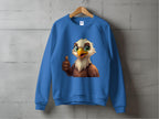 This blue sweatshirt from Garment Graphics features a playful cartoon eagle with large green eyes giving a thumbs-up, available in unisex sizes. Displayed against a concrete wall, the eagles cheerful expression adds a lively touch.
