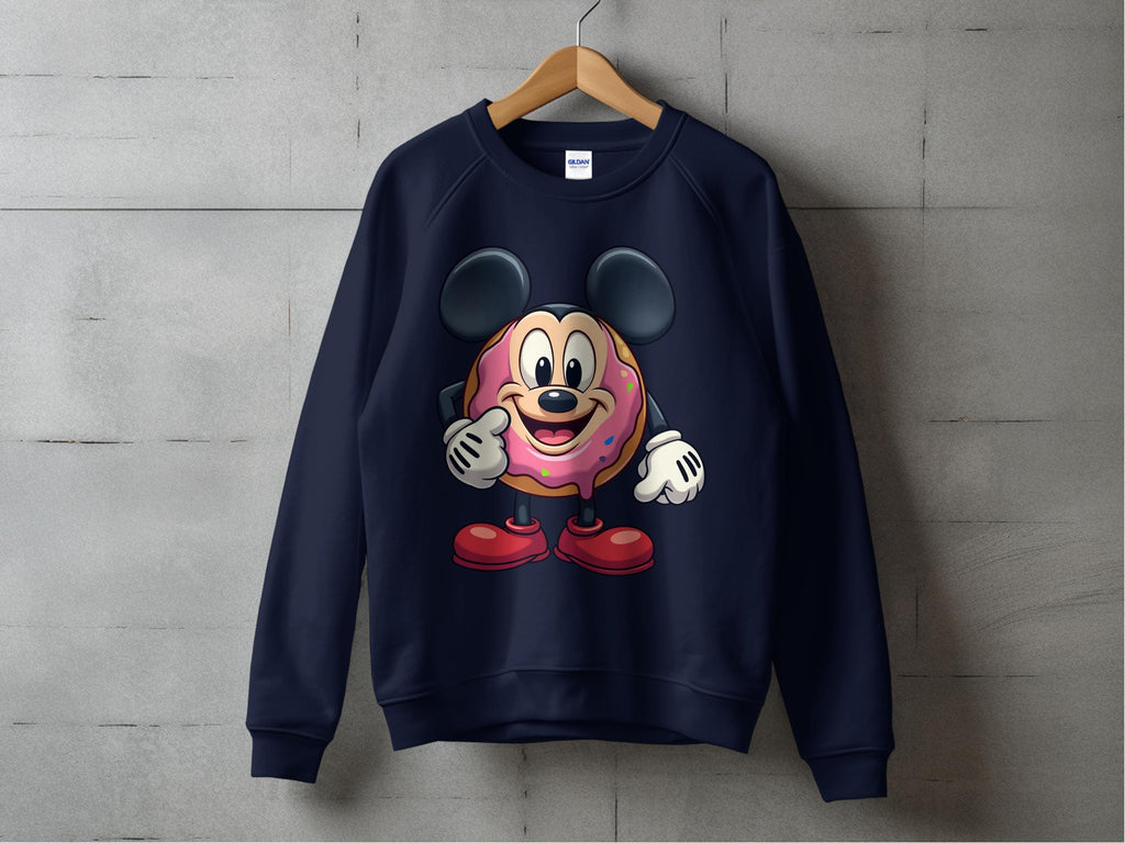 A navy blue Garment Graphics sweatshirt hangs on a wooden hanger with a quirky graphic—a character with big black ears, red shoes, and a cute cartoon sprinkle donut in the center—adding playful charm to any outfit.