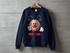A navy blue Garment Graphics sweatshirt hangs on a wooden hanger with a quirky graphic—a character with big black ears, red shoes, and a cute cartoon sprinkle donut in the center—adding playful charm to any outfit.