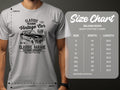 Someone is wearing a white Garment Graphics Vintage Car Club classic fit T-shirt. A size chart for the Gildan 5000 heavy cotton T-shirt shows sizes S to 5XL, with corresponding width and length in inches.