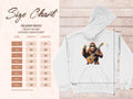 An image displays Garment Graphics electric guitar hoodie, with a bear playing an electric guitar graphic. The white sweatshirt is laid flat showing width and length dimensions. A size chart on the left details measurements for S to 5XL, ideal for music enthusiasts.