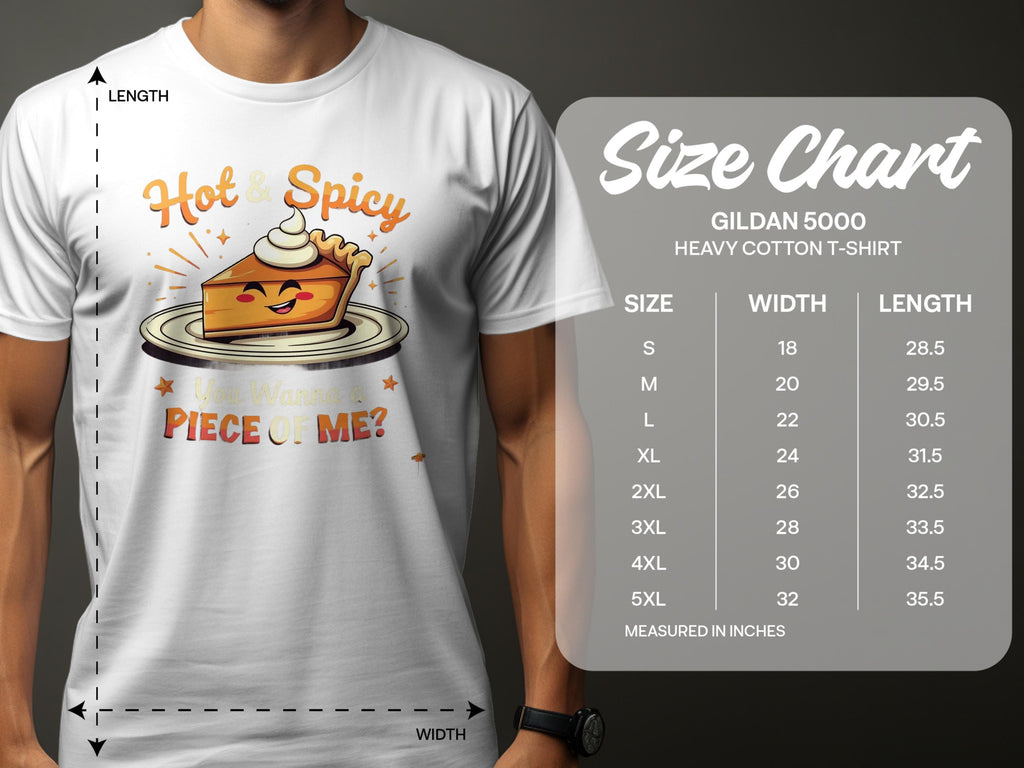 A person wears a white Garment Graphics T-shirt with a hot and spicy pie design and the playful text Hot & Spicy, Wanna Piece of Me? Nearby, a family sizing chart for Gildan 5000 T-shirts shows sizes S to 5XL, featuring width and length measurements in inches.