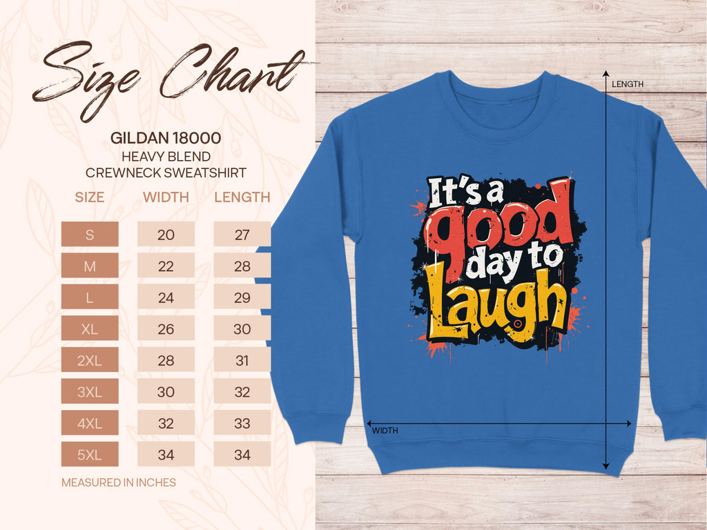 The Garment Graphics Its a Good Day to Laugh sweatshirt has vibrant lettering on a blue background, available in unisex sizing. The detailed Gildan 18000 size chart covers S to 5XL measurements for width and length in inches.