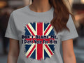 A person is wearing a gray 100% cotton T-shirt by Garment Graphics, featuring a striking Union Jack design and the slogan DONT BLAME ME, I Didnt Vote For Him.