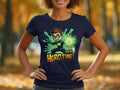 A person outside, against blurred autumn foliage, showcases a Garment Graphics navy blue T-shirt featuring an animated superhero with brown hair and a glowing green outfit. The shirt is emblazoned with the text Its Hero Time!.