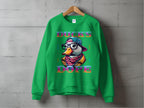Garment Graphics presents a green sweatshirt with a cartoon duck in sunglasses, a backwards cap, and scarf, featuring DUCKS DOPE in bold letters. Made from medium-heavy fabric and unisex sized, its displayed on a wooden hanger against a concrete wall.