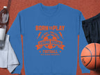 A Garment Graphics blue football sweatshirt with BORN TO PLAY and YOUNG SQUAD FOOTBALL around a soccer ball graphic is displayed beside black shorts, a basketball, water bottle, and white towel. Perfect for young aspiring footballers in unisex sizing.