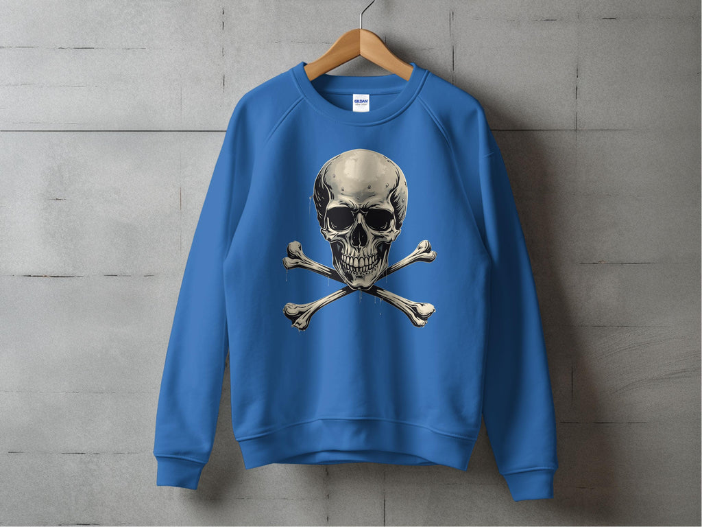 A blue Garment Graphics sweatshirt, with an edgy skull and crossbones graphic, hangs on a wooden hanger against a concrete wall. Unisex sizing ensures comfort and style for all.