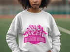 A person sports a white sweatshirt with a pink graphic of three illustrated women in beach attire. The text says Always Party Beach Girl and Garment Graphics, embodying laid-back fun. The backdrop suggests an outdoor sports court, enhancing the carefree vibe.