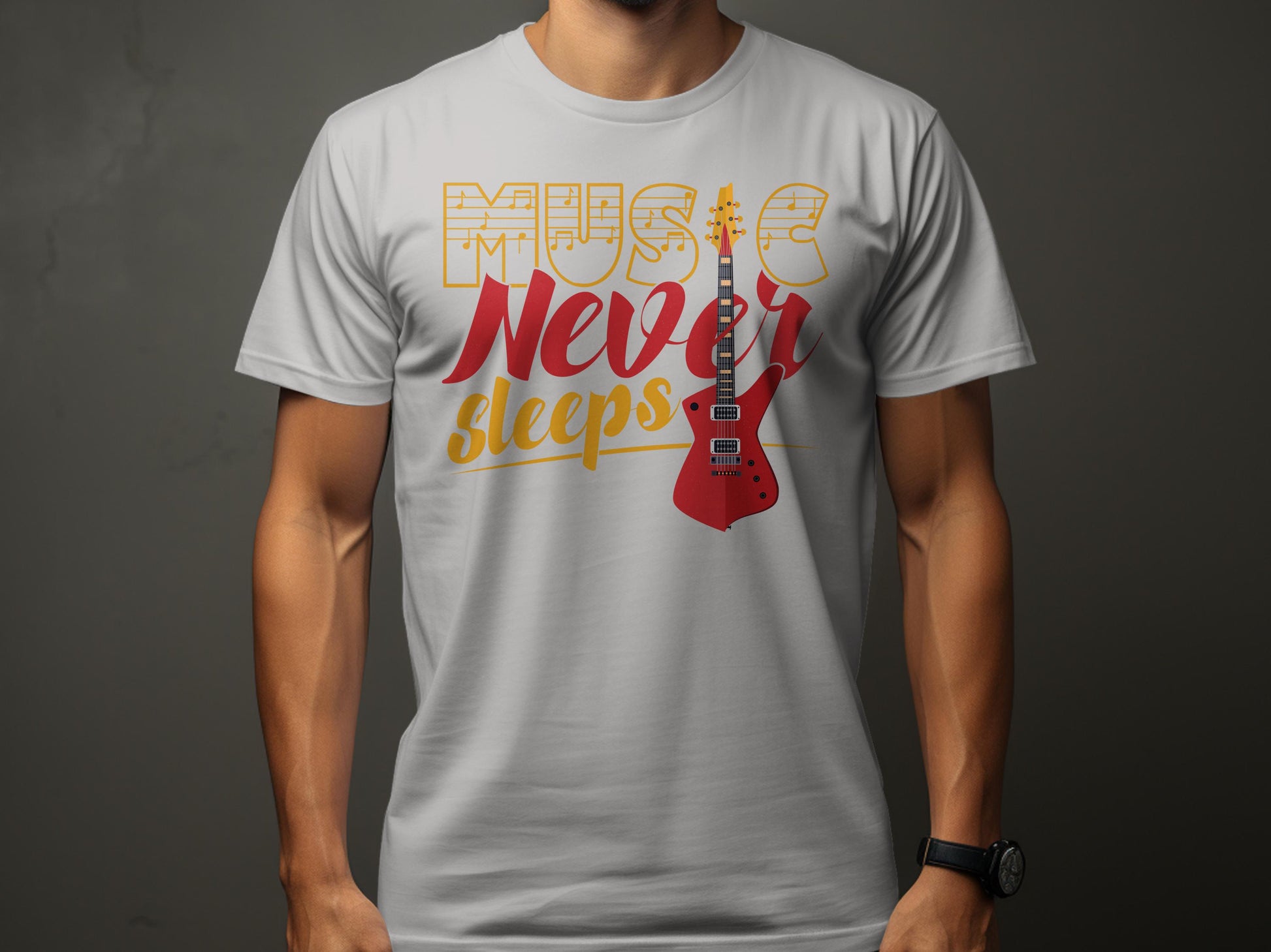 A person wears a Garment Graphics T-Shirt featuring Music Never Sleeps in bold on its light gray, 100% cotton fabric. The design highlights a vibrant red electric guitar against a dark, neutral backdrop.