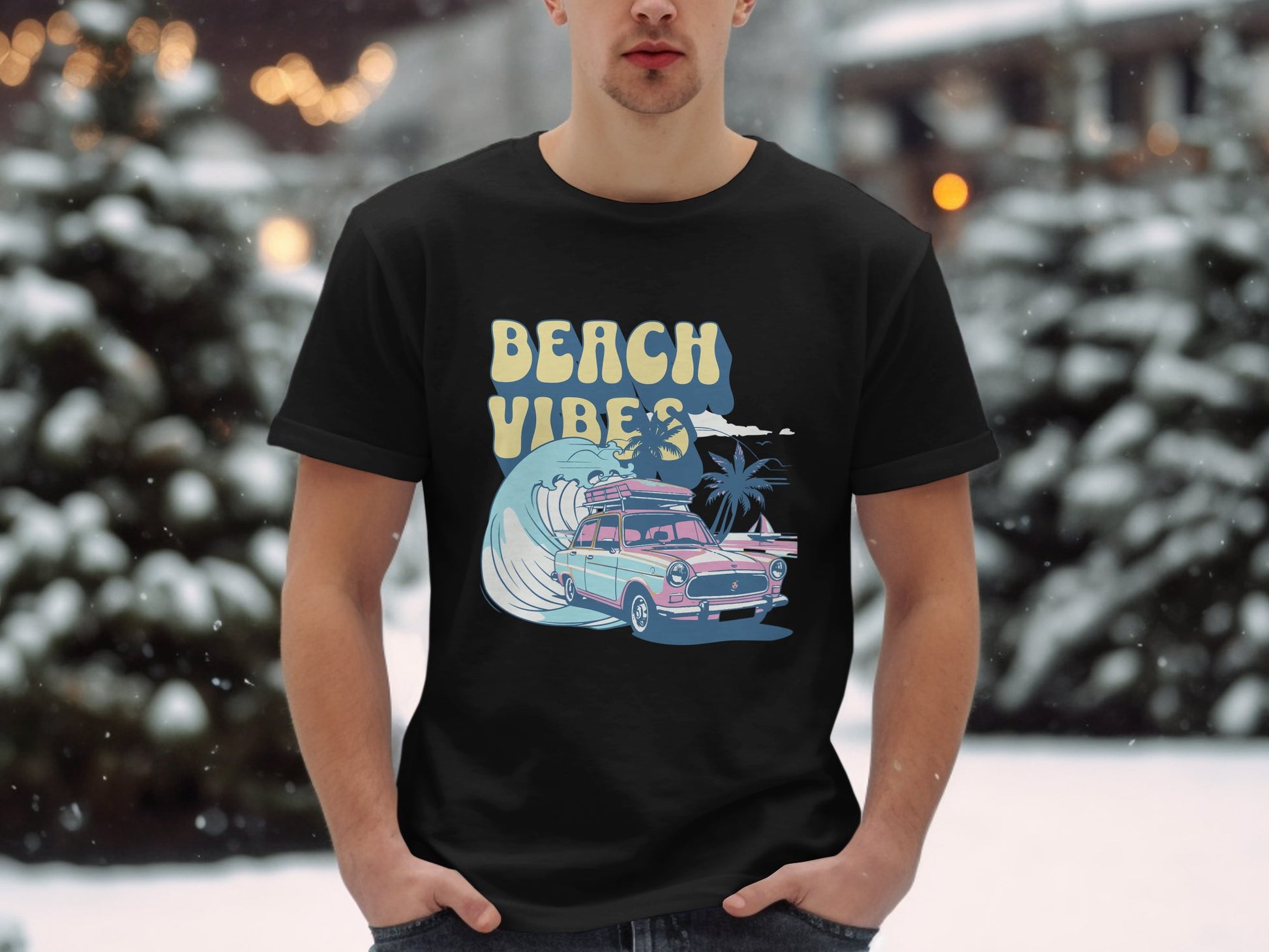 In the snow, someone wears a Garment Graphics t-shirt featuring BEACH VIBES, along with a classic pink car, surfboard, palm trees, and waves.