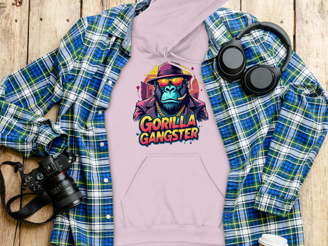 A person in a black Garment Graphics hoodie displays vivid Gorillas Artwork featuring a gangster-styled gorilla. With sunglasses, hat, and cigar, the gorilla captures the streetwear vibe. Gorilla Gangster is prominently shown below.