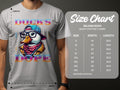 A man models Garment Graphics white Ducks Dope T-shirt, showcasing a duck with glasses, cap, and scarf. Beside him is the size chart for the Gildan 5000 heavy cotton tee, available in sizes S to 5XL.