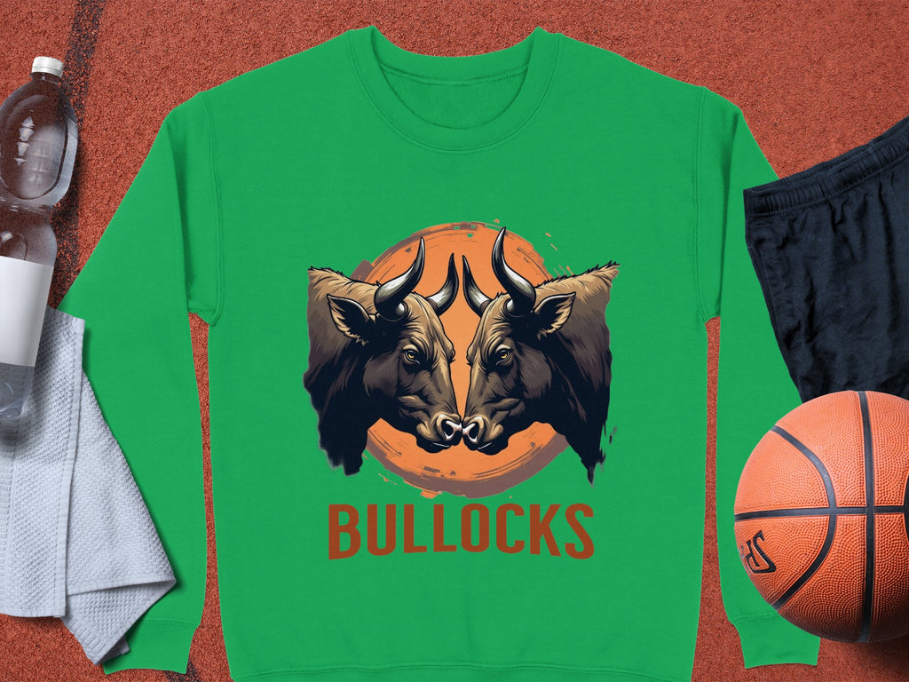Garment Graphics unisex green bull graphic sweatshirt features a striking bullock design with BULLOCKS below. Styled with a towel, water bottle, black shorts, and a basketball.