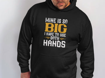 Someone wearing Garment Graphics classic fit hoodie showcases the bold phrase, Mine is so big I have to use both hands, with playful graphics of two pointing fingers.