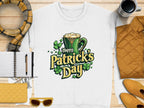 Garment Graphics offers a white T-shirt with Happy Patricks Day in green and gold, featuring clovers and a beer mug. This festive design is paired with a plaid scarf, sunglasses, yellow purse, coffee mug, quilted jacket, notebook, and pen for stylish St. Patricks Day celebrations!.