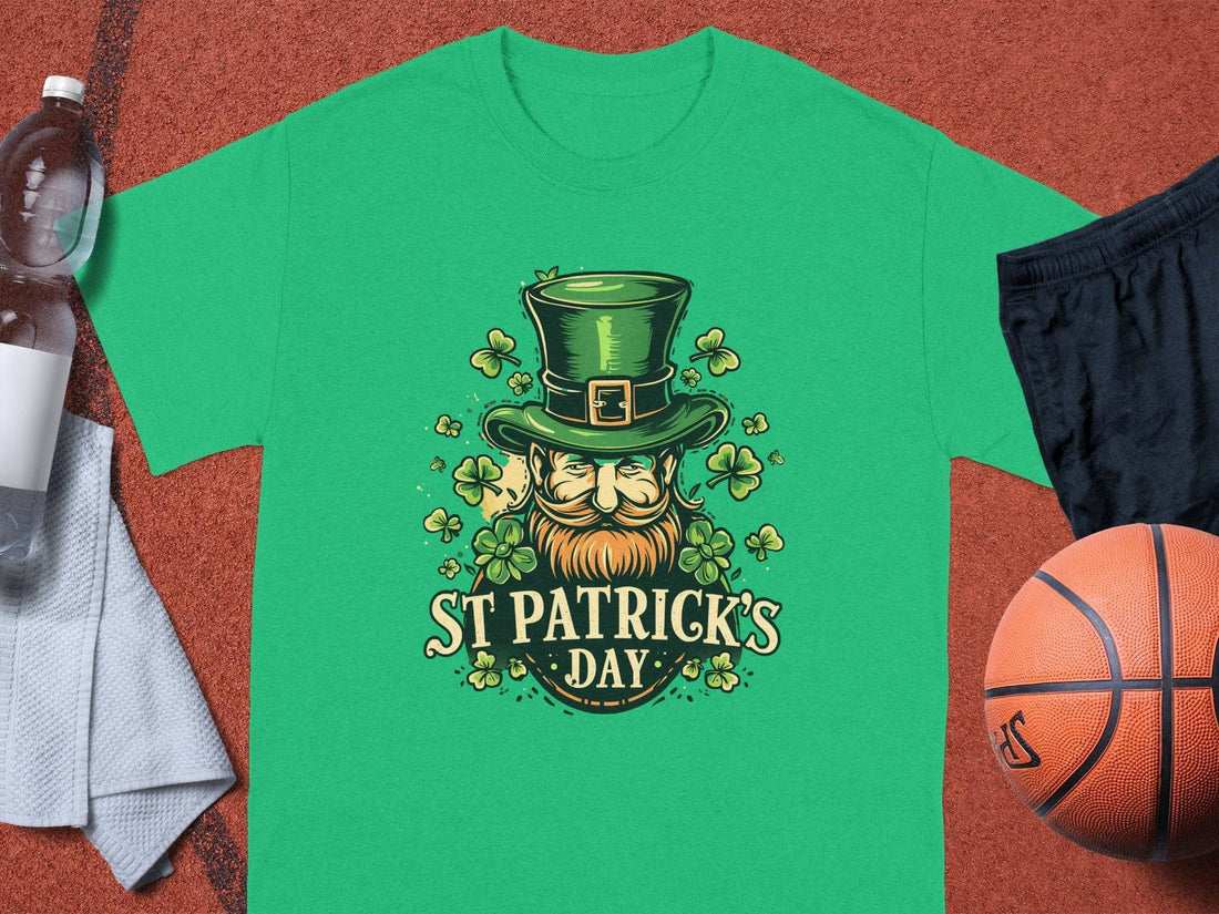 A white t-shirt by Garment Graphics hangs on a wooden hanger against a gray background, featuring an Irish pride print: a ginger-bearded man with a green top hat and shamrock designs, with the text St. Patricks Day, capturing the festive spirit of St. Patricks Day T-Shirts.