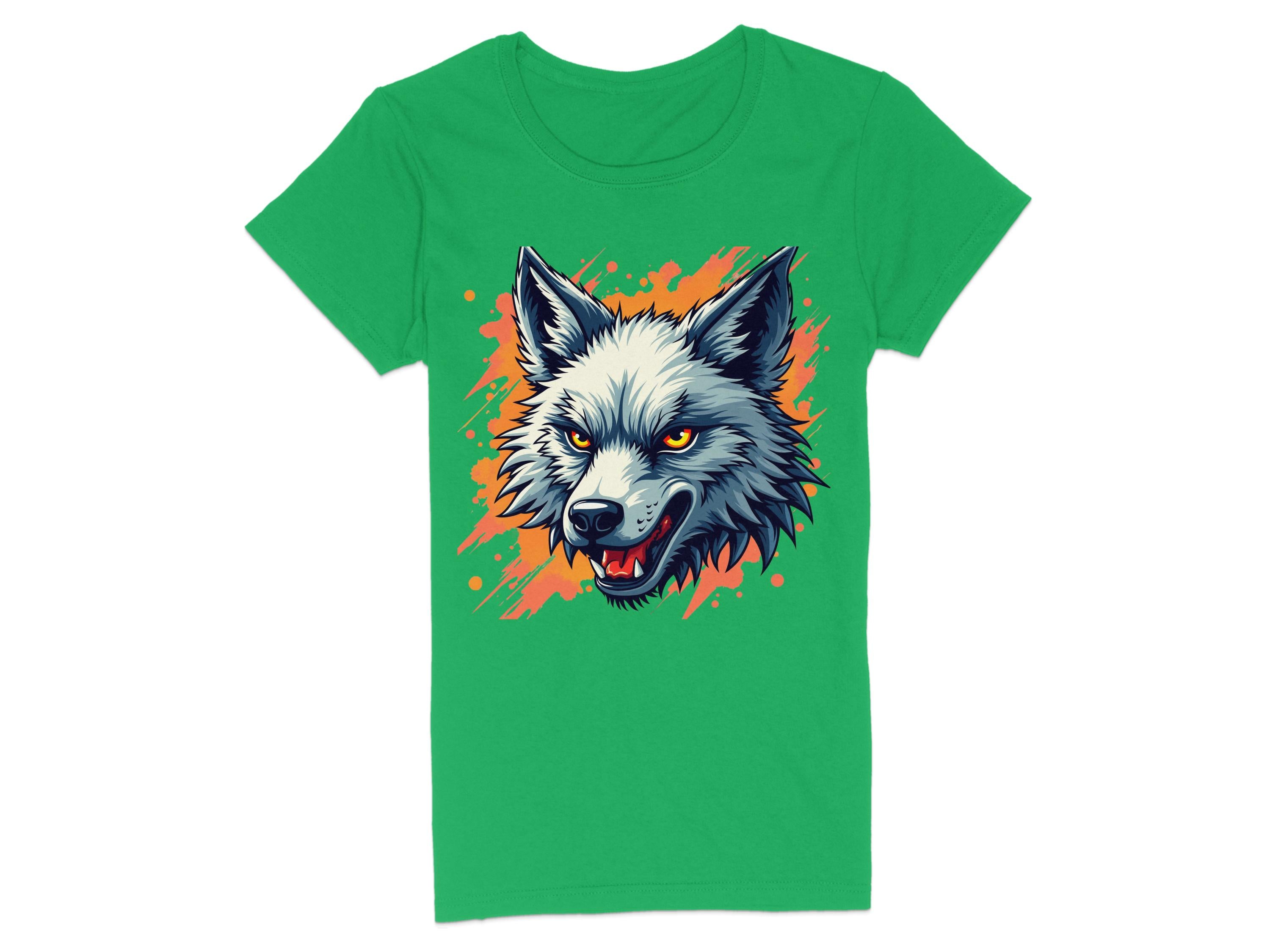 A striking Garment Graphics T-shirt in green, made of 100% cotton, features a daring wolf graphic at its center. The wolf has grey and white fur with orange and black details, sharp teeth, and bright yellow eyes against an abstract orange splatter background.