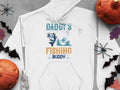 The Garment Graphics Daddys Fishing Buddy hoodie features a boat with a person and fish, set on gray with Halloween accents like pumpkins, bats, spiders, leaves, and a skeleton—ideal for adventure lovers who enjoy festive flair.