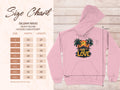 On the right, a pink One Love hoodie by Garment Graphics showcases two palm trees and a tropical sunset. Beside it, a size chart titled Gildan 18500 details sizes S to 5XL in inches—ideal for fans of unique graphic hoodies.