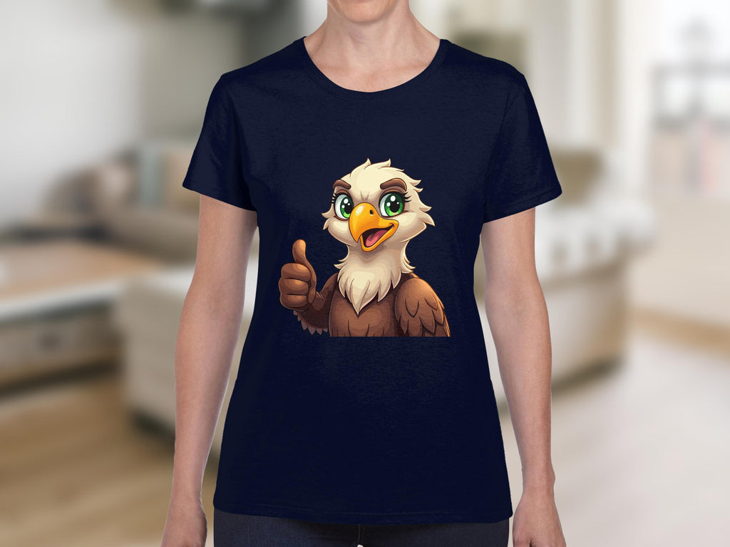A person wearing a Garment Graphics T-shirt with a cartoon cheerful eagle giving a thumbs up, set against a blurred indoor background, ideal for animal lovers.