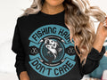 A fishing enthusiast with wavy hair dons a black Garment Graphics fishing sweatshirt featuring a fish, the phrase Fishing hair dont care, circles, and two small fishhooks.