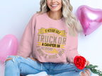 A woman sits cross-legged on the floor, holding a red rose, wearing Garment Graphics pink sweatshirt with amusing golf trucks and campers text. Her ripped jeans match her cheerful smile, while two heart-shaped balloons enhance the playful ambiance.
