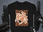 Garment Graphics black print sweatshirt features a design of a person riding a horse with Howdy Rodeo above and below. A speech bubble reads Not Dangerous. With unisex sizing, it pairs perfectly with your phone, smartwatch, or speaker.