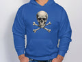 A fashion-forward individual displays a Garment Graphics blue hoodie featuring a striking skull and crossbones graphic. The sleek design stands out against the crisp white background, highlighting the trendy appeal of the hoodie.