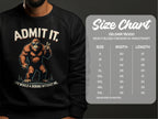 A person wears a Garment Graphics black sweatshirt featuring Sasquatch with a peace sign and the text Admit It. Life Would Be Boring Without Me. A size chart for the Gildan 18000 sweatshirt is available, offering precise measurements.