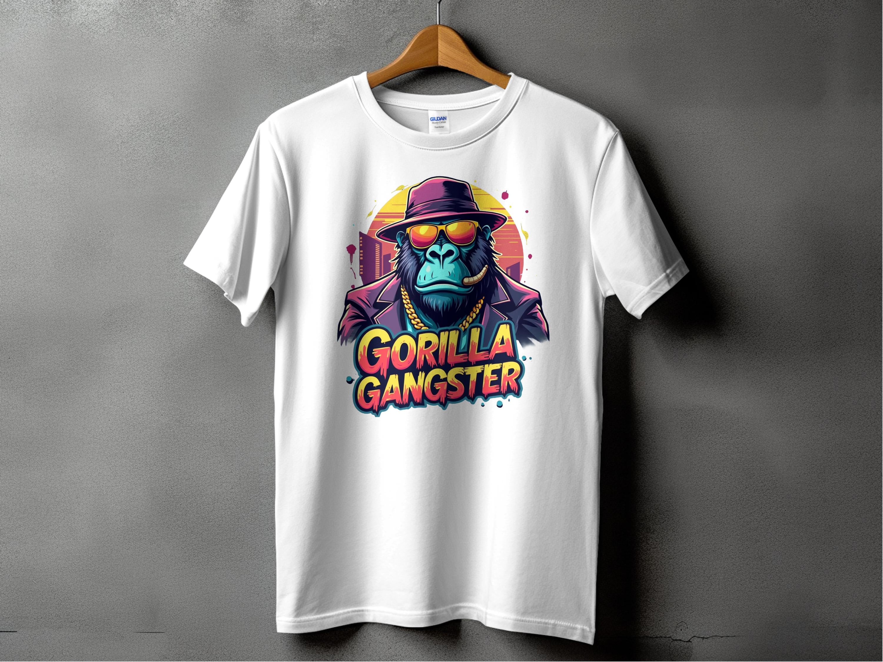 Garment Graphics Graphic T-Shirt features a bold gorilla in a hat and sunglasses with the text GORILLA GANGSTER on a plain background, making it eye-catching and vibrant.