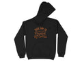 Garment Graphics presents a black hoodie with its hood up, ideal for coffee lovers. The front showcases orange stylized text: THIS DAY IS Powered BY Coffee. An essential piece for anyone needing a caffeine kick to start the day.