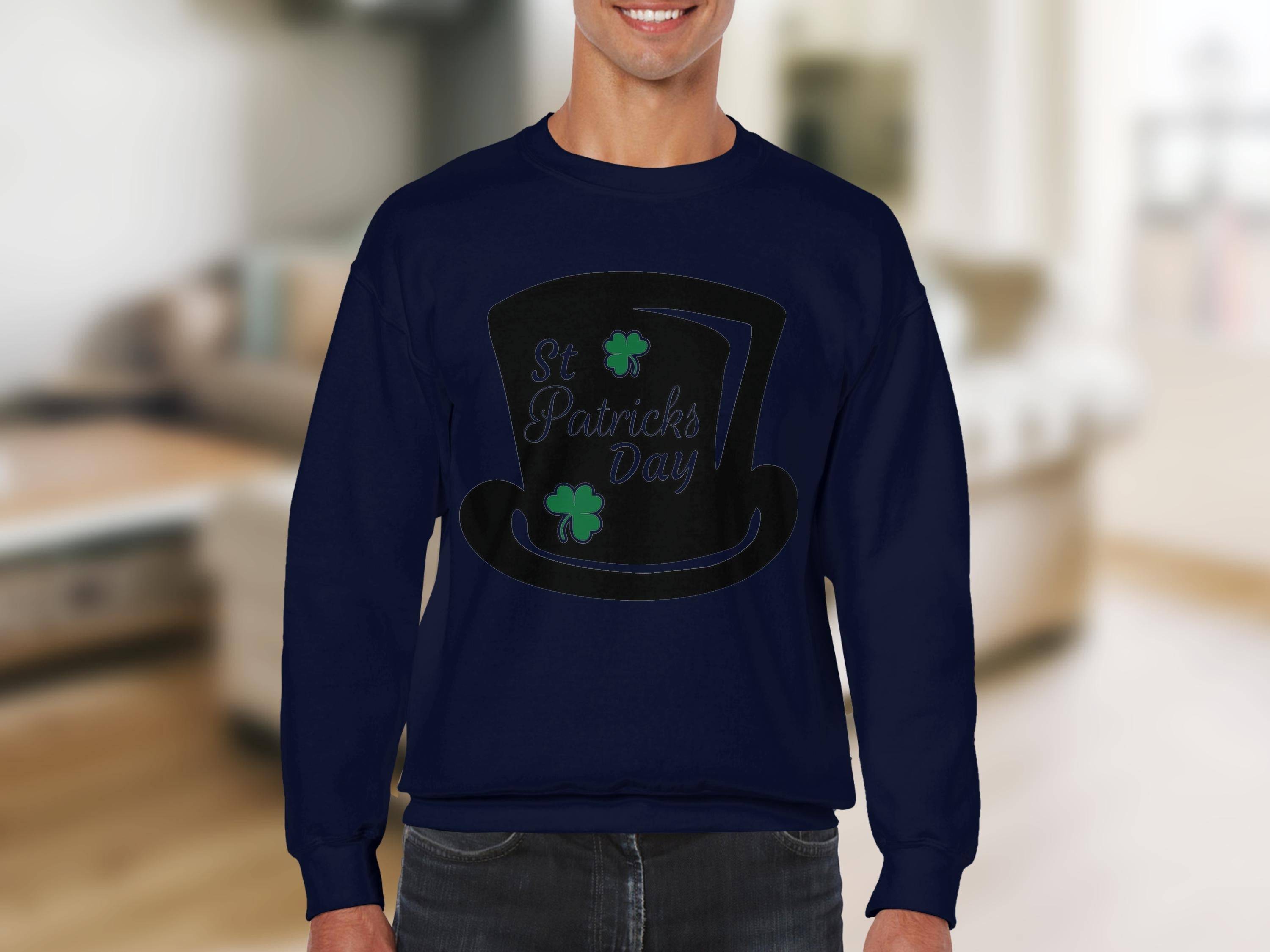 Sporting a Garment Graphics navy sweatshirt with a top hat, clover, and St Patricks Day text captures the festive spirit against a softly blurred indoor backdrop with neutral tones.