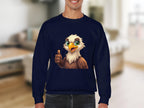 A person sports a navy blue Garment Graphics sweatshirt with a joyful cartoon eagle giving a thumbs-up, set against a softly focused neutral backdrop that enhances the playful vibe of this unisex sizing apparel.