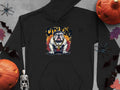 Garment Graphics black hoodie features a bulldog design with a belt and City King above it. This urban piece is styled with pumpkins, a small skeleton, plastic bats, and spiders on a gray backdrop.