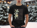 In the chilly outdoors, an individual sports a Garment Graphics casual black T-shirt with a grinning green alligator holding a basketball. It proudly showcases See You Later Alligator, merging style and playfulness for any casual occasion.