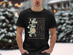 In the chilly outdoors, an individual sports a Garment Graphics casual black T-shirt with a grinning green alligator holding a basketball. It proudly showcases See You Later Alligator, merging style and playfulness for any casual occasion.
