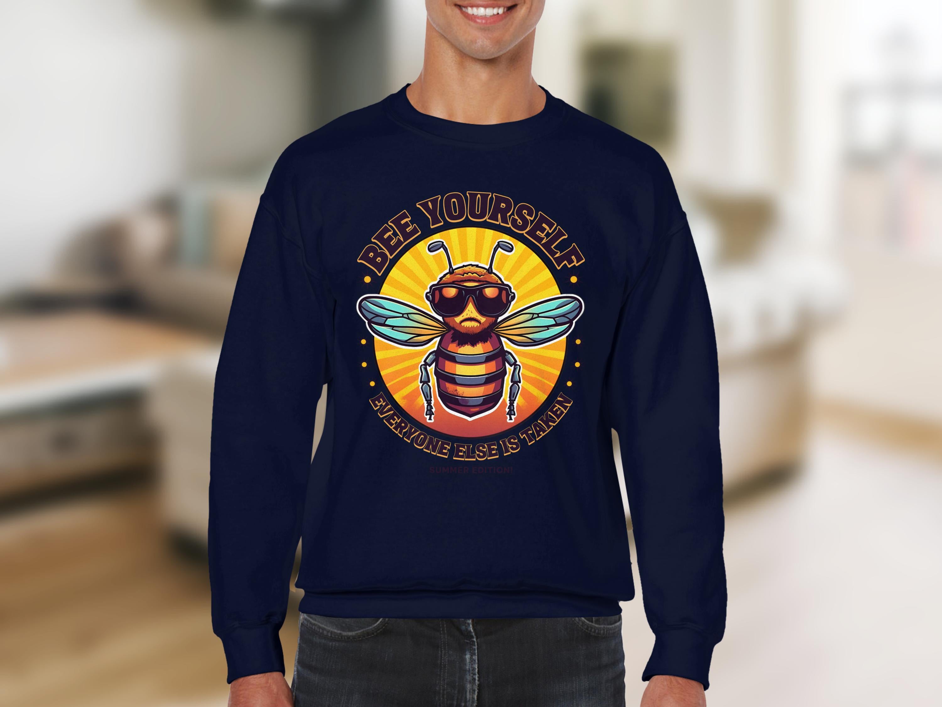 Sporting Garment Graphics navy blue Summer Edition Sweatshirt featuring a graphic bee with sunglasses and the phrase Bee Yourself above Everyone Else is Taken, this unisex design suits any blurred indoor background.