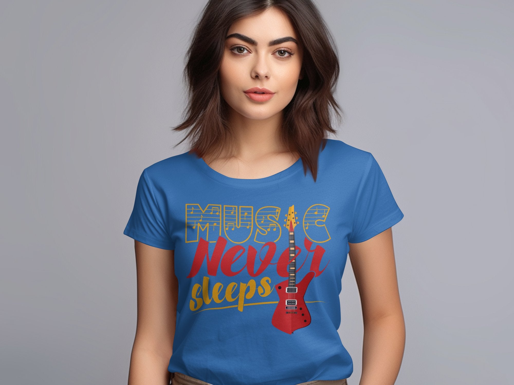 A person with shoulder-length brown hair sports a unique Garment Graphics t-shirt, featuring a blue design with Music Never Sleeps text and a red electric guitar image. The plain gray background highlights the striking details of the guitar t-shirt.