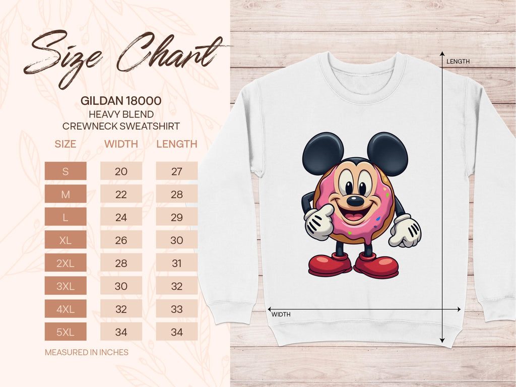 Image of a size chart for Garment Graphics Gildan 18000 Heavy Blend Crewneck Sweatshirt, sizes S to 5XL with width and length in inches. Beside it, a quirky sweatshirt showcases an adorable mouse holding a cute cartoon donut, perfect for adding charm to any playful wardrobe.