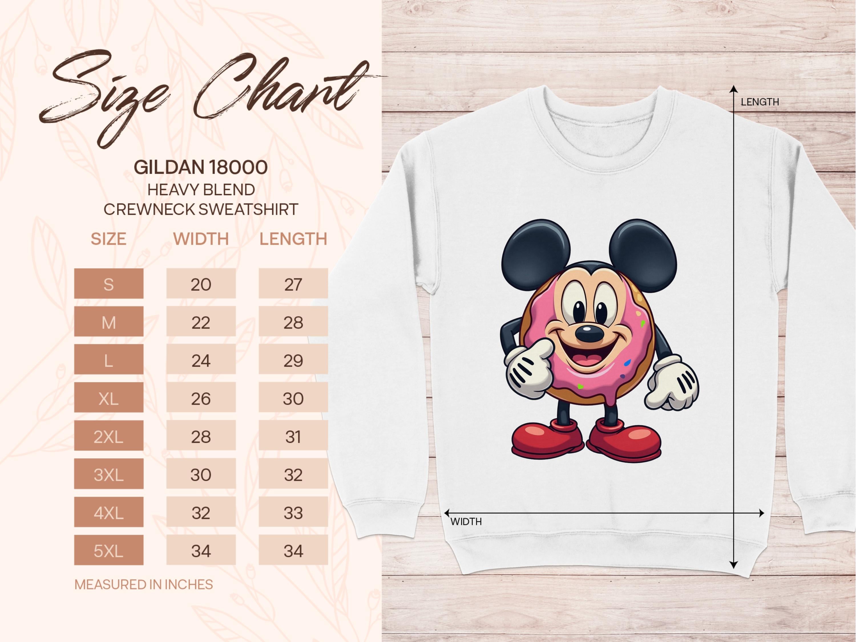 Image of a size chart for Garment Graphics Gildan 18000 Heavy Blend Crewneck Sweatshirt, sizes S to 5XL with width and length in inches. Beside it, a quirky sweatshirt showcases an adorable mouse holding a cute cartoon donut, perfect for adding charm to any playful wardrobe.
