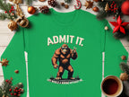 Garment Graphics presents a statement piece: a green sweatshirt with a Bigfoot graphic and the text Admit It. Life would be boring without me, alongside festive Christmas ornaments, pine cones, and a cozy coffee cup.