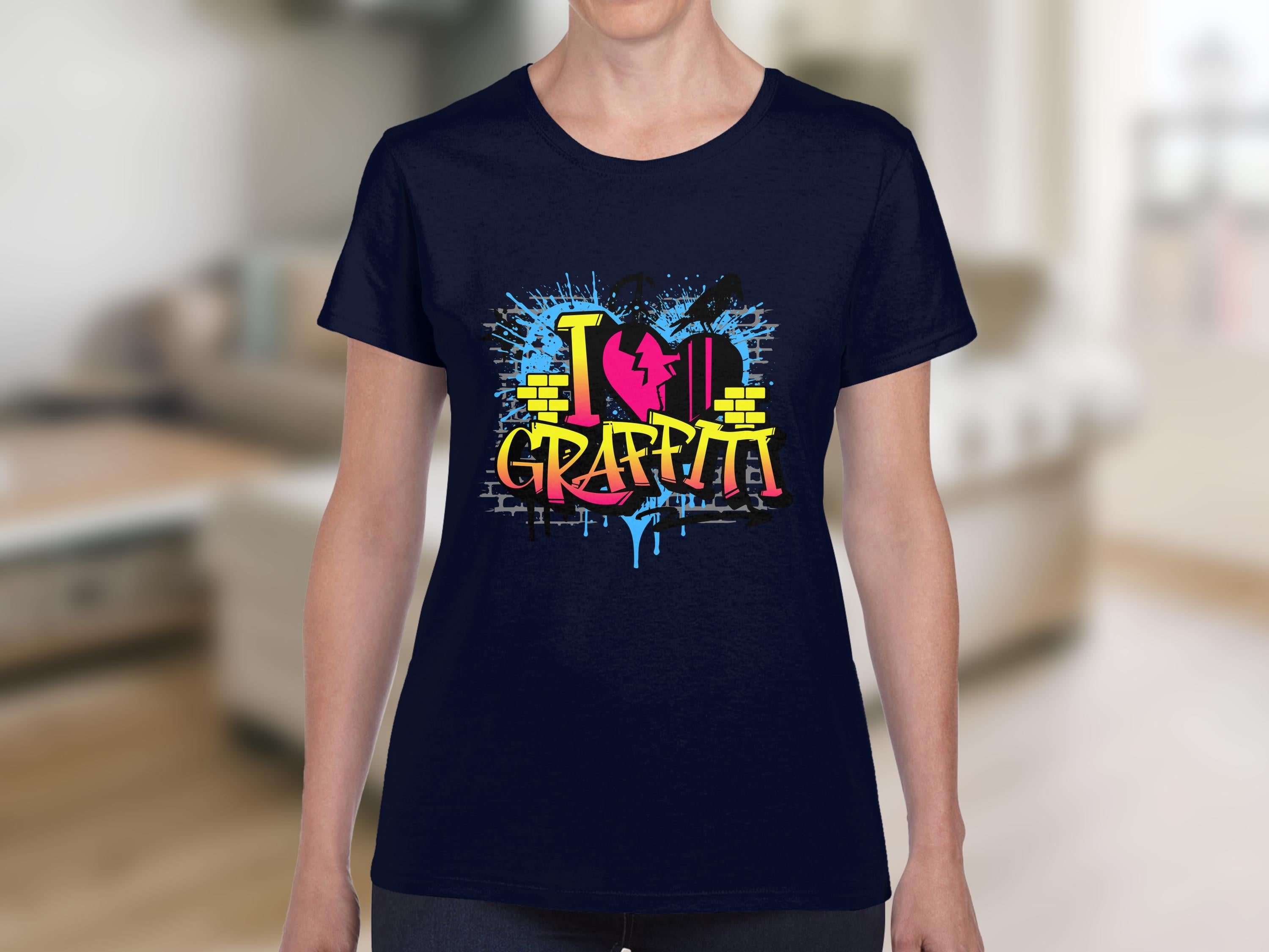 A bold urban design by Garment Graphics, the navy T-shirt features graffiti-style I ♥ Graffiti text, adorned with yellow, pink, and blue bricks and splatters that capture street arts essence against a blurred indoor backdrop.