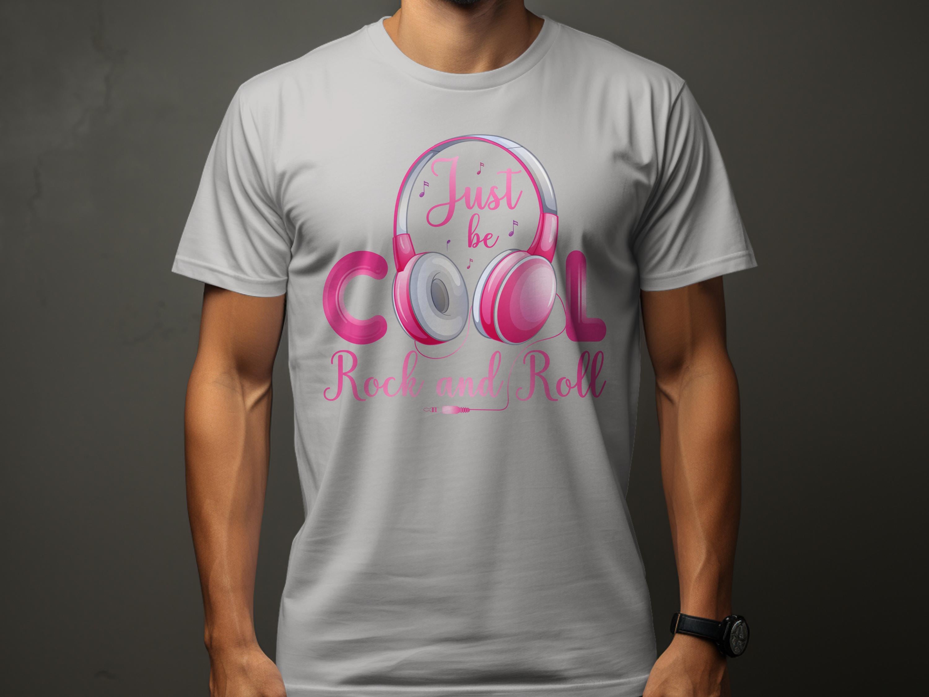 A music enthusiast dons a white Garment Graphics t-shirt with pink and gray headphones and the text Just be Cool, Rock and Roll, ideal for those who love stylish rock and roll apparel.