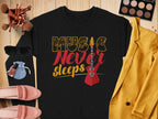 A stylish Garment Graphics sweatshirt with the Music Never Sleeps Guitar design is displayed on a wooden surface. Surrounding it are makeup brushes, an eyeshadow palette, sunglasses, a yellow jacket, a small bag, nail polish, lipsticks, and pink shoes—ideal for music lovers with fashion flair.